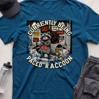 CURRENTLY BEING PACED BY A RACCOON  T-shirt