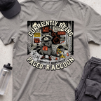 CURRENTLY BEING PACED BY A RACCOON  T-shirt
